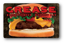 Grease Burger logo on top cheeseburger over dark wooden background